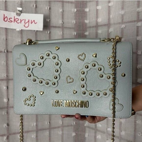 Love Moschino Handbags - Love Mochino blue leather crossbody bag with hearts in blue and gold colors